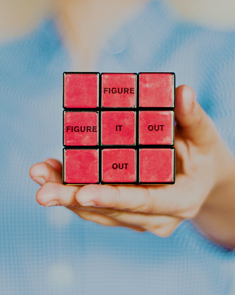 A Rubiks cube featuring the words 'figure it out'